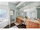 Bright bathroom featuring double sinks, a soaking tub, and a separate shower at 1929 Baguette Dr, Castle Rock, CO 80108