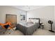 Well-lit bedroom with a modern gray bed, neutral carpet, and sleek design at 1929 Baguette Dr, Castle Rock, CO 80108