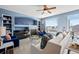 Bright living room features a cozy fireplace, modern furniture, and large window with natural light at 1929 Baguette Dr, Castle Rock, CO 80108