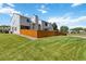 Backyard featuring a lush green lawn and a wooden fence ensuring privacy and beauty at 9155 W Portland Ave, Littleton, CO 80128