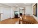 Bright dining area with wood floors, a large table, and easy access to other rooms at 9155 W Portland Ave, Littleton, CO 80128