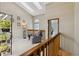 Loft area with skylights, comfortable seating, and a view of the office at 9155 W Portland Ave, Littleton, CO 80128