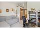 Comfortable office space featuring a sofa, desk and shelving at 9155 W Portland Ave, Littleton, CO 80128