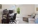 Office space featuring a computer setup and a comfortable chaise lounge for breaks at 9155 W Portland Ave, Littleton, CO 80128