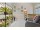 Comfortable area with a chair, plant shelf, and natural light at 9155 W Portland Ave, Littleton, CO 80128