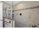 Walk-in shower with glass enclosure and tile surround at 16057 Ledge Rock Dr, Parker, CO 80134