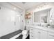 Stylish bathroom features white subway tile shower and modern vanity with marble countertop at 2000 Willow Ln, Lakewood, CO 80215