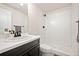 This bathroom features walk-in shower, modern vanity and sink at 5088 S Quail St, Littleton, CO 80127