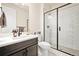 Stylish bathroom with a modern vanity, glass-enclosed shower, and contemporary fixtures at 5088 S Quail St, Littleton, CO 80127