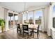 Bright dining area with a backyard patio view, wood flooring, and natural light at 5088 S Quail St, Littleton, CO 80127