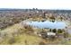 Scenic aerial view of a park with a lake and the Denver skyline in the background at 1034 S Williams St, Denver, CO 80209