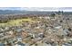 Panoramic aerial view of the neighborhood with lush greenery and the Denver skyline at 1034 S Williams St, Denver, CO 80209