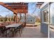 Outdoor deck area perfect for entertaining with a pergola and view of the backyard at 1034 S Williams St, Denver, CO 80209