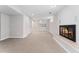 Spacious carpeted basement featuring a fireplace and wet bar at 1034 S Williams St, Denver, CO 80209