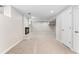 Unfinished basement with carpeting and fireplace at 1034 S Williams St, Denver, CO 80209