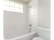 A clean, bright bathroom featuring a well-maintained tub and shower at 1034 S Williams St, Denver, CO 80209