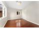 A cozy bedroom with a window, hardwood floors, a closet, and plenty of natural light at 1034 S Williams St, Denver, CO 80209