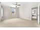 A bright and spacious bedroom with neutral tones and a ceiling fan at 1034 S Williams St, Denver, CO 80209