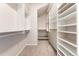 Walk-in closet with extensive custom shelving at 1034 S Williams St, Denver, CO 80209