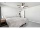 Comfortable bedroom with ceiling fan and access to kitchenette at 507 Bonneville Ave, Fort Lupton, CO 80621