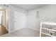 Bright bedroom with double doors and built in shelving at 507 Bonneville Ave, Fort Lupton, CO 80621