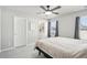 Spacious bedroom with ceiling fan and large windows at 507 Bonneville Ave, Fort Lupton, CO 80621