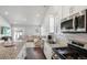 Modern kitchen with granite countertops, stainless steel appliances, and breakfast bar at 507 Bonneville Ave, Fort Lupton, CO 80621