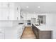 Contemporary kitchen boasts ample counter space, an island with sink, stainless steel appliances, and modern cabinetry at 8864 Moonshimmer Trl, Littleton, CO 80125