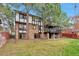 Three-story home with a large backyard and mature trees at 4853 S Crystal St, Aurora, CO 80015