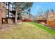 Large backyard with green lawn and a charming red gazebo, perfect for outdoor relaxation at 4853 S Crystal St, Aurora, CO 80015