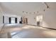 A large basement with a mini bar area, and neutral tones, perfect for any decor style at 4853 S Crystal St, Aurora, CO 80015