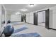Mirrored walls enhance this basement gym featuring exercise mats and workout equipment at 4853 S Crystal St, Aurora, CO 80015