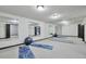 Bright basement gym or workout space with large mirrors and ample room for equipment at 4853 S Crystal St, Aurora, CO 80015