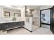 Stylish bathroom with double vanity, illuminated mirror, and a walk-in shower at 4853 S Crystal St, Aurora, CO 80015