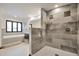 Modern bathroom featuring a large shower with dual shower heads and a soaking tub at 4853 S Crystal St, Aurora, CO 80015