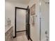 Bathroom featuring a vanity, framed mirror, and a shower with glass door at 4853 S Crystal St, Aurora, CO 80015