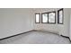Bedroom with neutral carpet and abundant light from the large windows at 4853 S Crystal St, Aurora, CO 80015