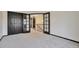 Bedroom with closet with open doors leading to upstairs hall at 4853 S Crystal St, Aurora, CO 80015