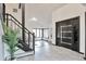 Bright foyer with stylish door and staircase, offering a welcoming entrance at 4853 S Crystal St, Aurora, CO 80015