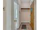 Hallway featuring period tile and architectural trim at 2421 W 38Th Ave, Denver, CO 80211
