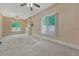 Spacious living room with carpet, large windows and a decorative fireplace at 2421 W 38Th Ave, Denver, CO 80211
