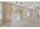 Spacious living room with neutral carpeting, a decorative fireplace, and plenty of natural light at 2421 W 38Th Ave, Denver, CO 80211