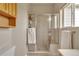 Bathroom featuring a glass enclosed shower with tile surround and a window at 29333 Rawhide Ct, Elizabeth, CO 80107