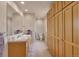 Well-lit bathroom featuring a double sink vanity, generous storage cabinets, and a toilet at 29333 Rawhide Ct, Elizabeth, CO 80107