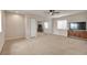 Bright bedroom with large closet, neutral carpet, ceiling fan, and a dresser with a television at 29333 Rawhide Ct, Elizabeth, CO 80107
