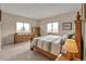 Comfortable bedroom featuring a wood frame bed, a dresser, and natural light at 29333 Rawhide Ct, Elizabeth, CO 80107