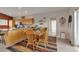Open kitchen and dining area featuring a wooden table and light wood cabinets at 29333 Rawhide Ct, Elizabeth, CO 80107