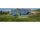 Back exterior view of this two story house that includes a deck and backyard with trees at 29333 Rawhide Ct, Elizabeth, CO 80107