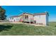 Well-maintained single-Gathering home with inviting porch and manicured lawn under a clear blue sky at 29333 Rawhide Ct, Elizabeth, CO 80107