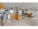 Spacious kitchen and living area with wood cabinets, a kitchen island, and comfortable seating at 29333 Rawhide Ct, Elizabeth, CO 80107